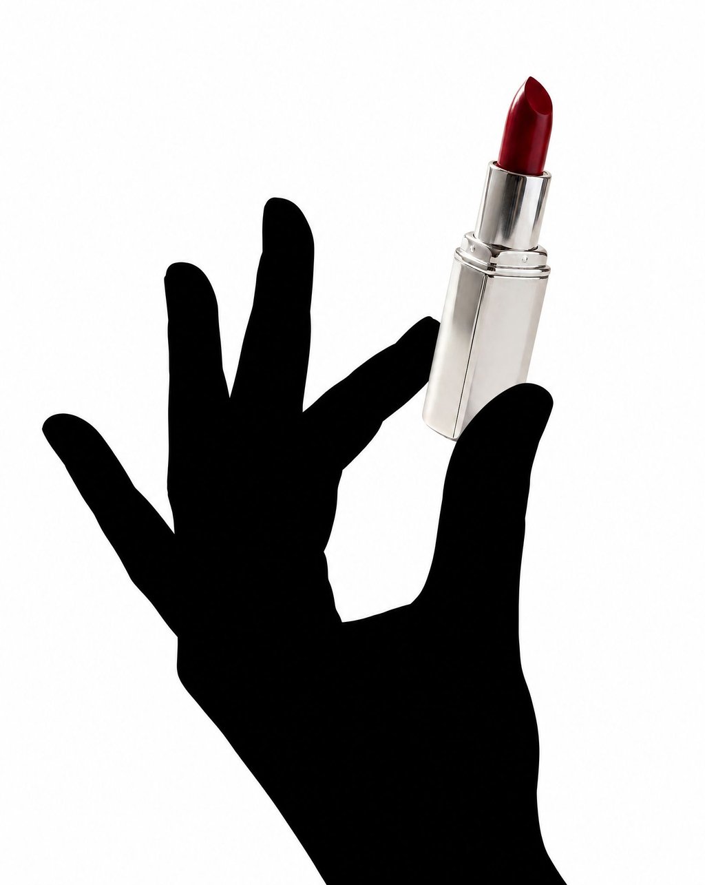 A red lipstick in a silver tube held by a black silhouetted hand against white