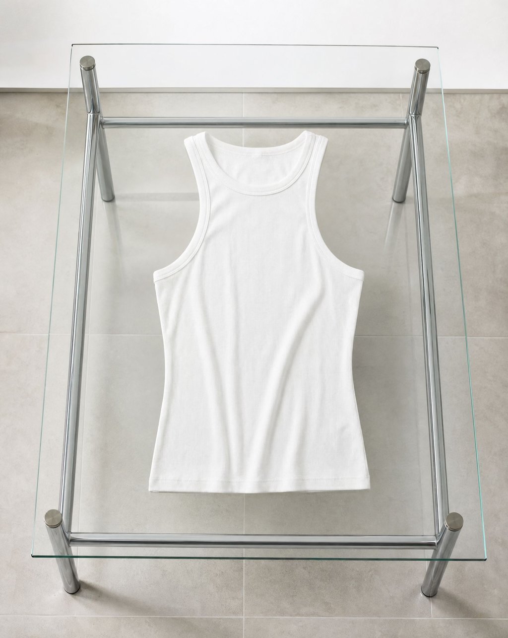 A white ribbed cotton tank top photographed in even neutral light with no hard shadow