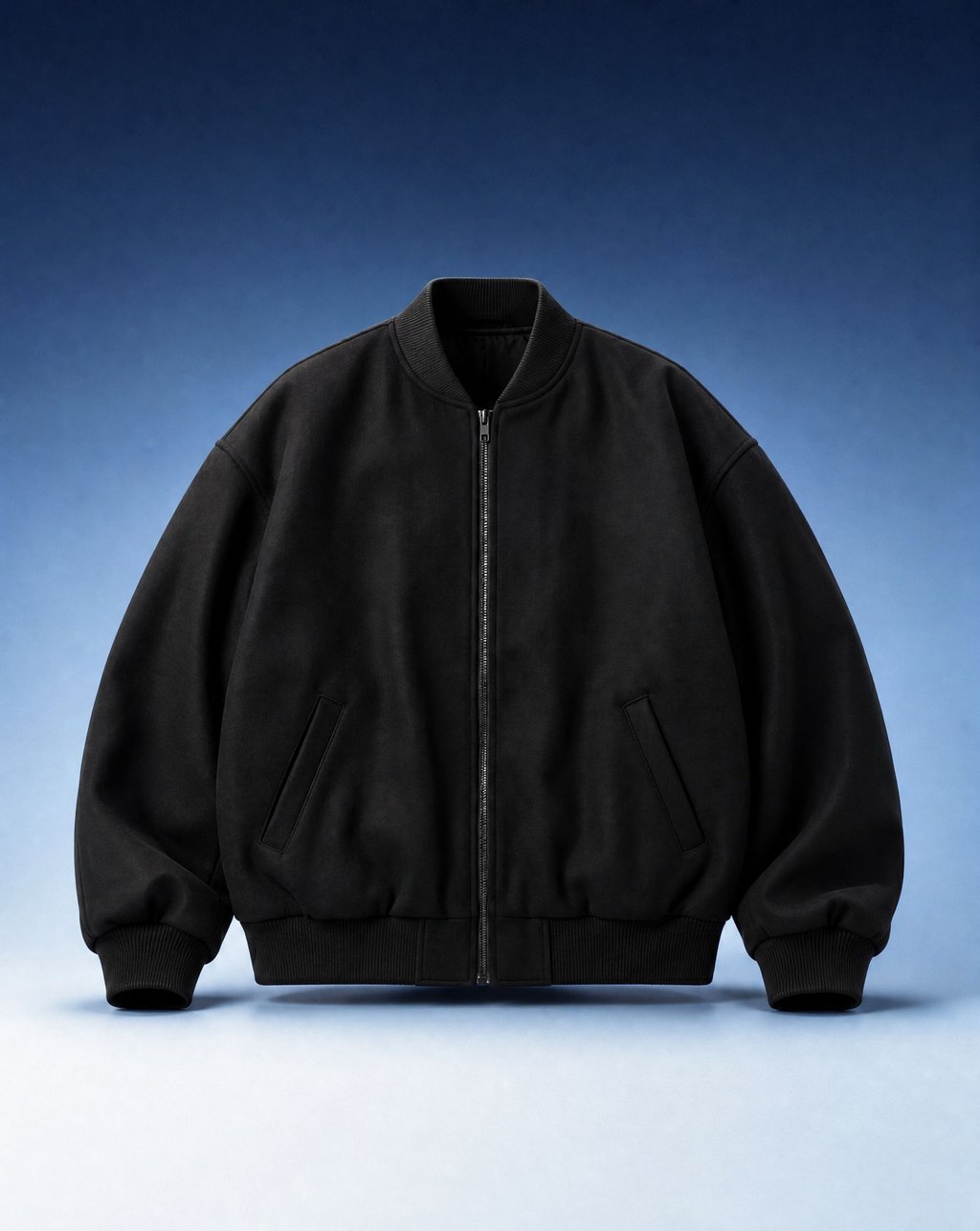 A black bomber jacket holding its worn shape with no body inside, hollow collar and empty sleeves, on a blue gradient background