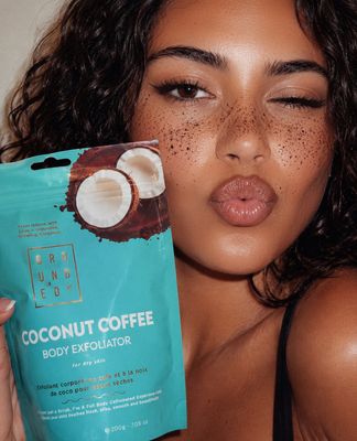a woman holding a bag of coconut coffee