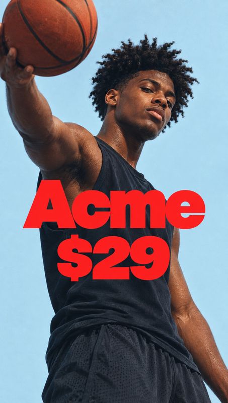 sleeveless athletic top model try-on product photo: A basketball player in a black sleeveless athletic top holds a ball against a clear blue sky, with bold red…