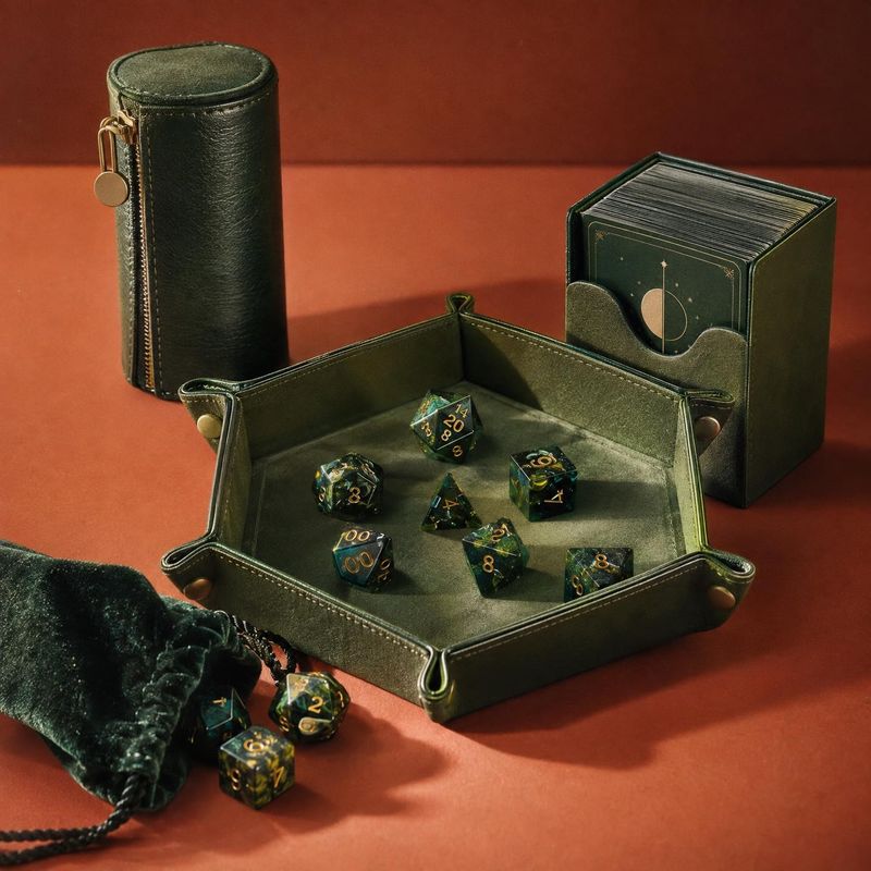 polyhedral dice set with leather accessories close-up detail product photo: A collection of dark green polyhedral dice and leather gaming accessories is arrang…
