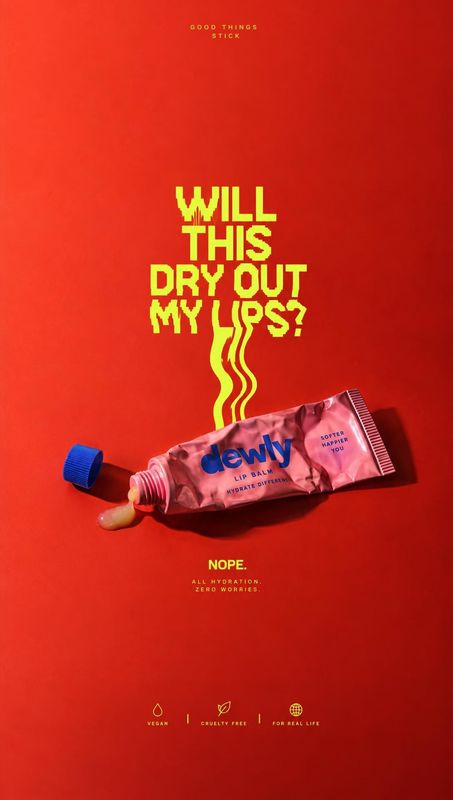 lip balm posters product photo: A pink lip balm tube lies open against a vivid red studio backdrop, with bold yellow lettering and graphic wavy lines giving th…