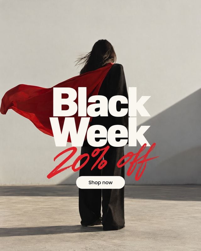 black outfit action & motion product photo: A model in a flowing black outfit and red cape stands against a sunlit concrete wall, overlaid with bold white and…