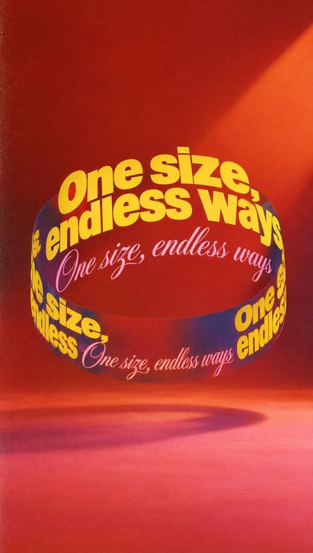 posters product photo: Bold yellow and pink lettering wraps around a floating loop against a dramatic red studio backdrop, creating a playful, graphic campaign…