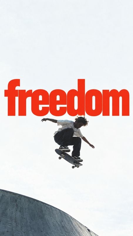skateboard posters product photo: A skateboarder hangs midair above a concrete ramp beneath oversized red “freedom” typography, set against a bright open sky f…