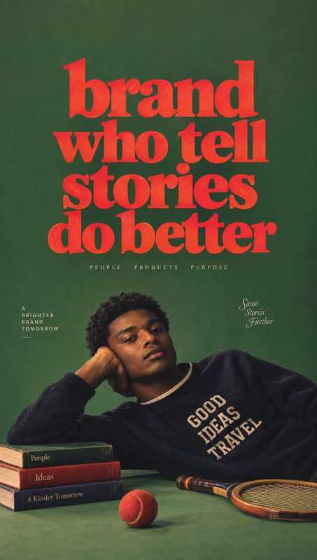 sweatshirt look book product photo: A casually posed man in a dark sweatshirt reclines beside stacked books and a tennis racket against a deep green studio bac…