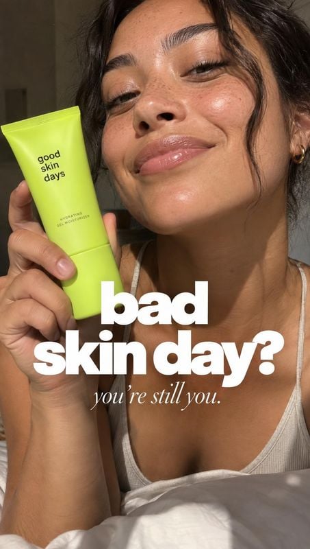 gel moisturizer beauty close-up product photo: A woman holds a bright lime-green skincare tube beside her face in warm indoor light, with bold white headline t…