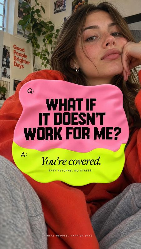 posters product photo: A woman in an orange sweater poses casually indoors behind a bold pink-and-neon-yellow returns message, creating a playful, reassuring r…