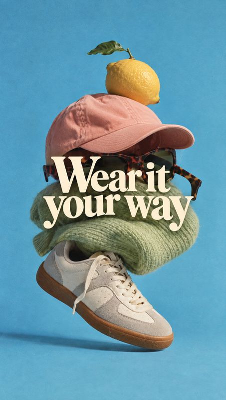 sneaker floating product product photo: A sneaker, knitwear, cap, sunglasses, and lemon are stacked in a whimsical floating arrangement against a bright blue s…