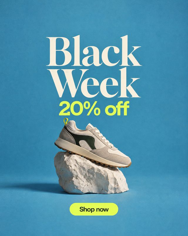 sneaker still life product photo: A beige-and-dark-green sneaker rests on a pale rock against a vivid blue studio backdrop, beneath oversized cream “Black Week…