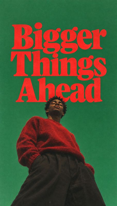 red sweater look book product photo: A low-angle fashion portrait shows a model in a red sweater against a vivid green backdrop, with oversized red headline le…