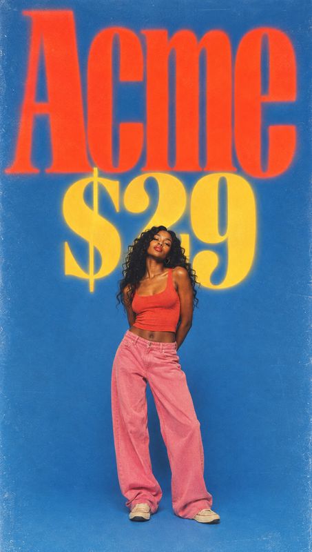 pink jeans and red crop top model try-on product photo: A woman poses in a red crop top, pink jeans and sneakers against a vivid blue studio backdrop, beneath…