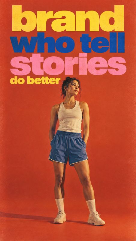athletic outfit posters product photo: A woman in a white tank, blue athletic shorts, socks and sneakers poses against a vivid orange studio backdrop beneath o…