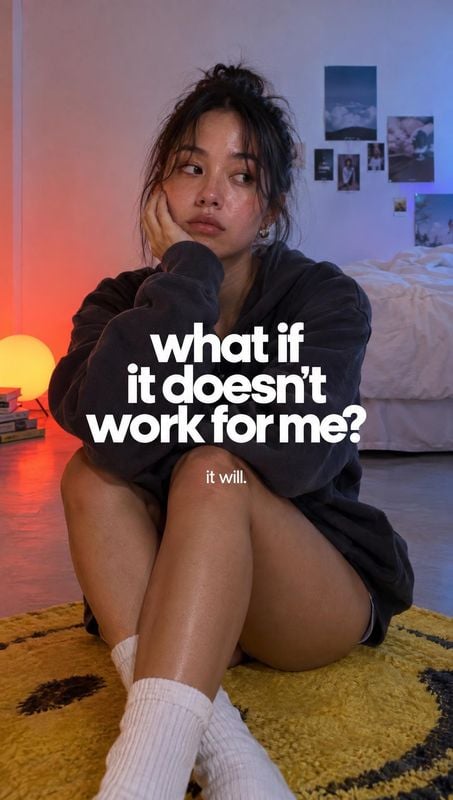 posters product photo: A young woman sits pensively on a bedroom rug in a dark sweatshirt and white socks, lit by contrasting warm red and cool blue light, wit…