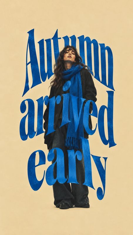 blue scarf autumn product photo: A model wears a dark layered outfit and vivid blue scarf against a warm beige studio backdrop, framed by oversized blue “Autum…