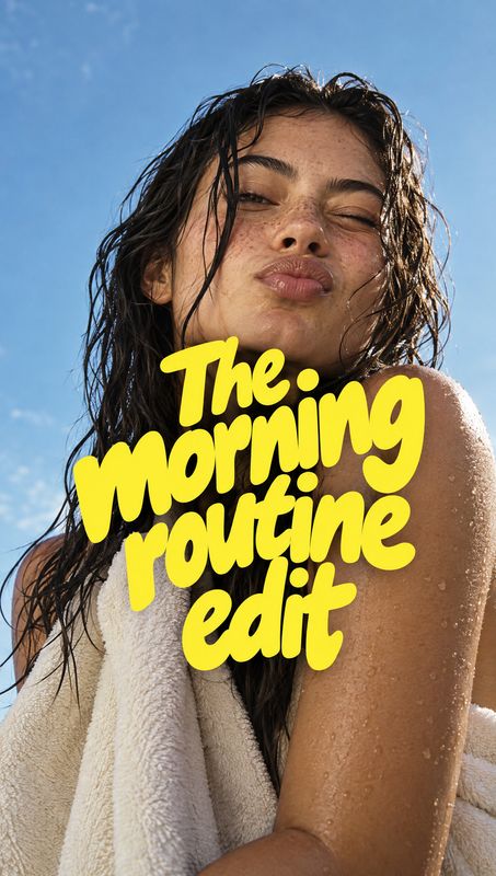 beauty close-up product photo: A close-up beauty portrait shows a wet-haired woman wrapped in a white towel against a bright blue sky, with bold yellow display…