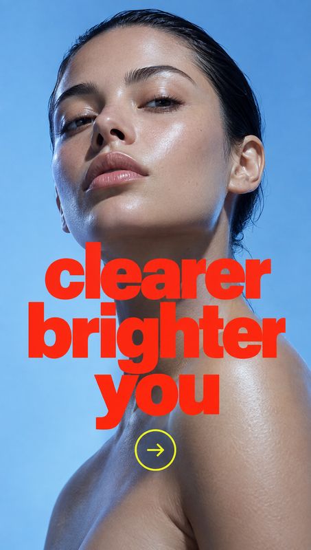 beauty close-up product photo: A close-up portrait of a woman against a cool blue studio backdrop, with glossy skin and bold red display text creating a clean,…