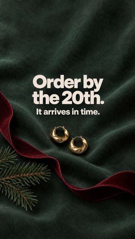 gold hoop earrings christmas product photo: Gold hoop earrings rest on dark green velvet beside evergreen sprigs and a red ribbon, with bold cream shipping-dea…