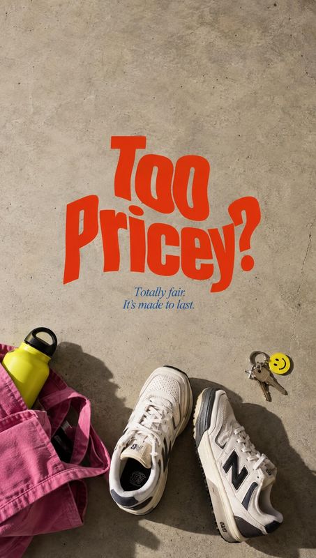 New Balance sneakers still life product photo: White New Balance sneakers sit on sunlit concrete beside a pink bag, a bright water bottle, and keys, while bold…