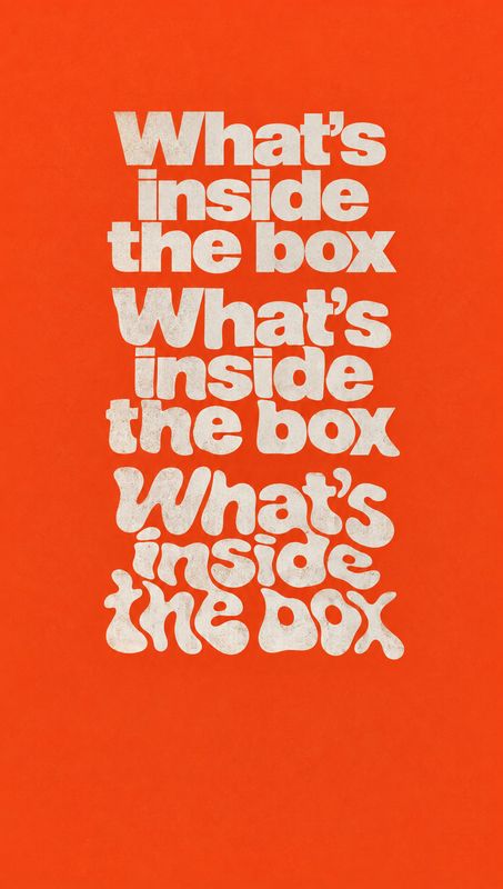 posters product photo: Repeated cream-colored lettering reading “What’s inside the box” is stacked down the center of a vivid orange-red textured background, c…