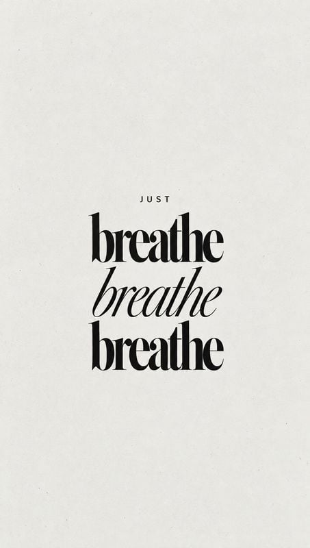 posters product photo: A minimalist typographic composition places the words “just breathe” in contrasting black serif styles on a softly textured off-white ba…