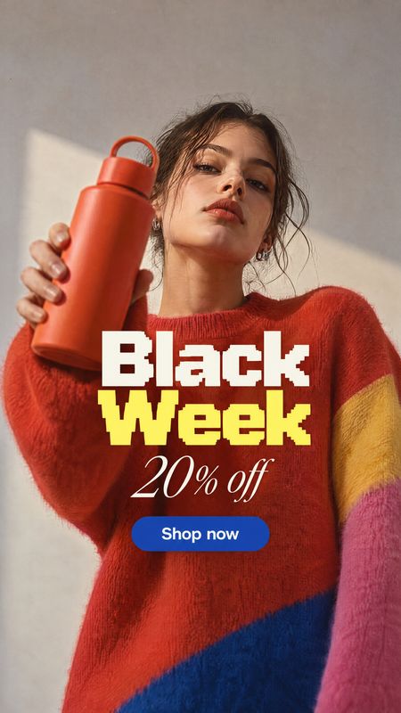 reusable bottle sports product photo: A woman in a bold color-block sweater holds an orange reusable bottle against a sunlit neutral wall, with oversized Black…