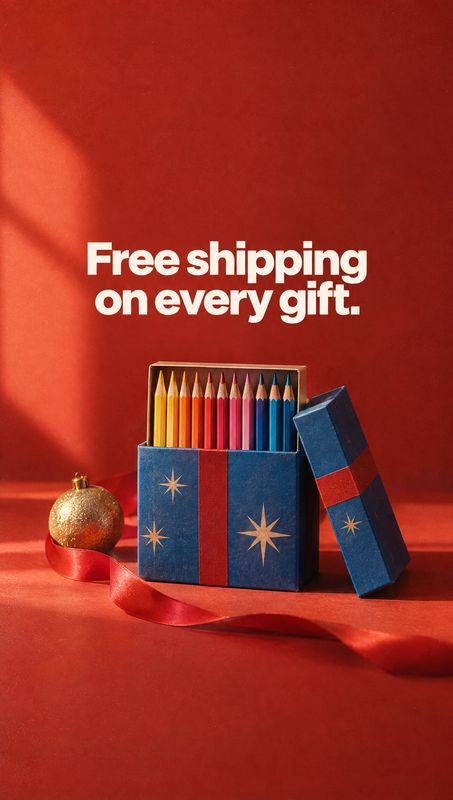 colored pencils stationery product photo: A festive box of colorful pencils, styled with a gold ornament and red ribbon against a rich red backdrop, sits benea…