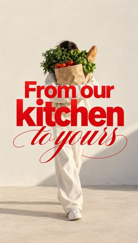 groceries food and drink product photo: A casually dressed person carries a paper bag filled with fresh produce and a baguette against a warm, sunlit neutral b…