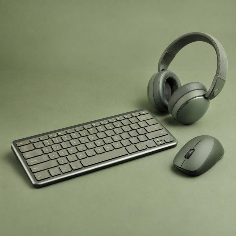 wireless headphones, keyboard, and mouse group lineup product photo: A coordinated set of olive-green headphones, keyboard, and mouse is arranged on a matching…