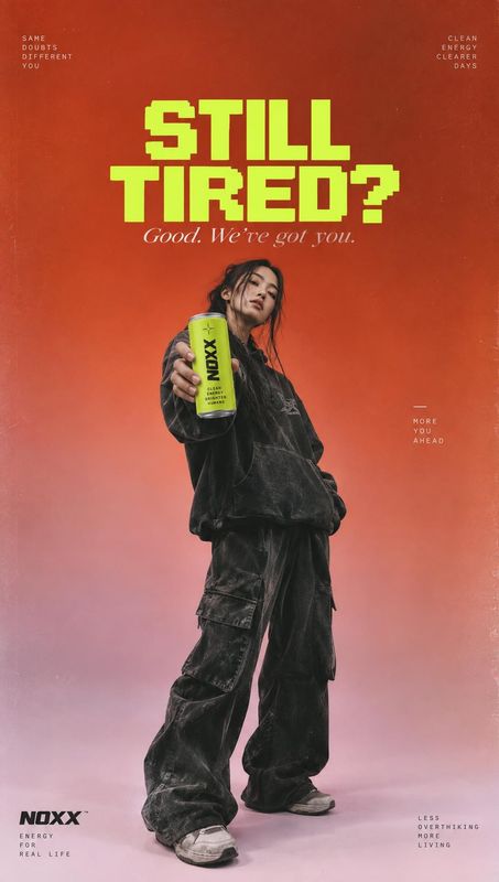 energy drink can food and drink product photo: A casually styled woman presents a bright lime-green energy drink can against a red-to-pink gradient, with bold…