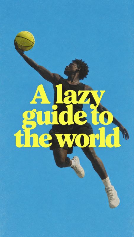 action & motion product photo: An airborne basketball player reaches toward the ball against a vivid blue sky, with bold yellow headline lettering layered acro…