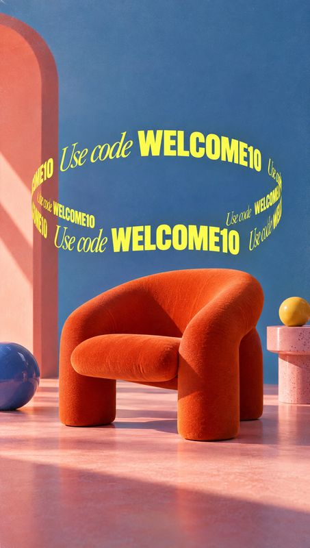 upholstered chair room set product photo: A sculptural orange upholstered chair sits on a pink floor among colorful props against a blue backdrop, with a loopi…
