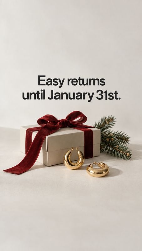 gold hoop earrings jewelry product photo: Gold hoop earrings sit beside a cream gift box tied with a red velvet ribbon and evergreen sprigs, beneath bold retur…
