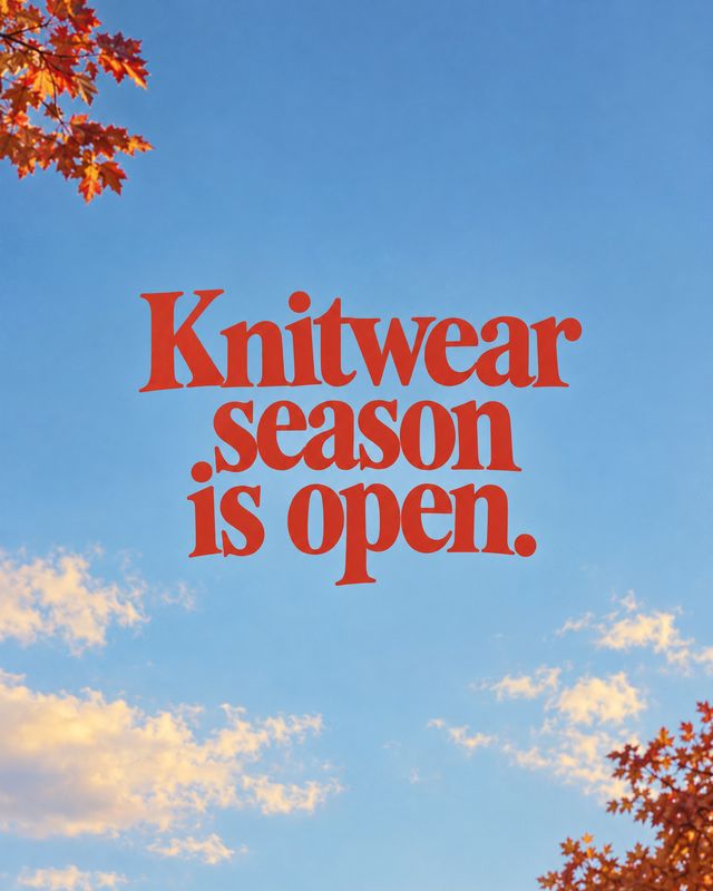 autumn product photo: Bold red display lettering announces knitwear season against a bright blue sky, framed by autumn leaves and soft clouds for a crisp seaso…