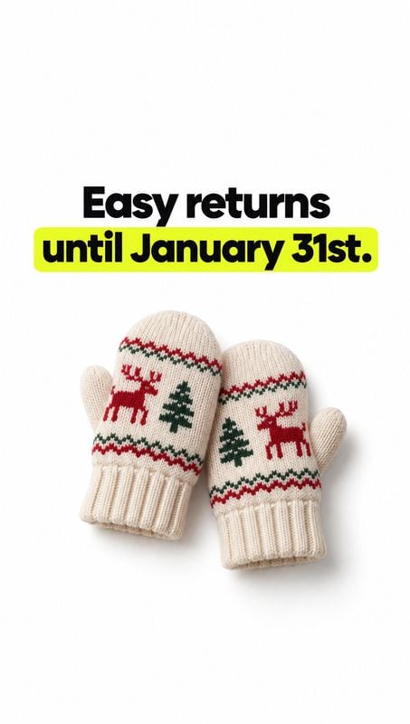 knitted Christmas mittens packshot product photo: A pair of cream knitted mittens with red reindeer and green tree motifs sits on a white studio background ben…