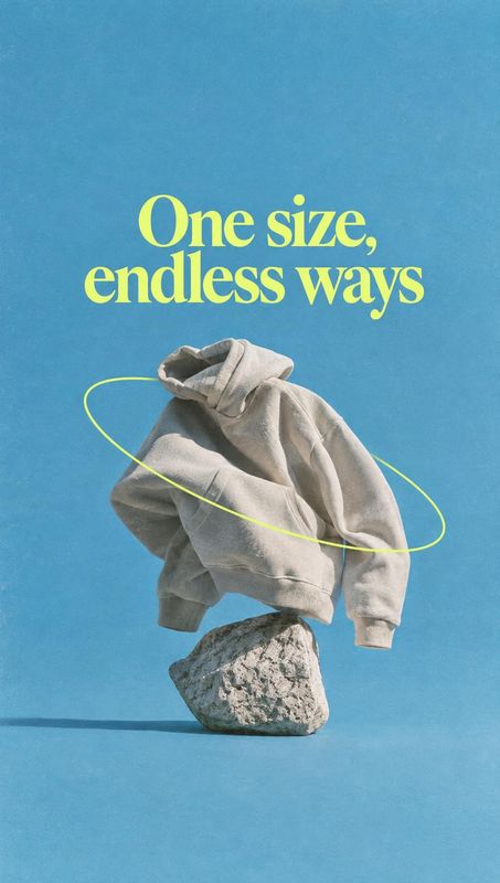 oversized hoodie floating product product photo: A soft gray hoodie floats above a rough stone against a bright blue backdrop, framed by a looping lime line an…