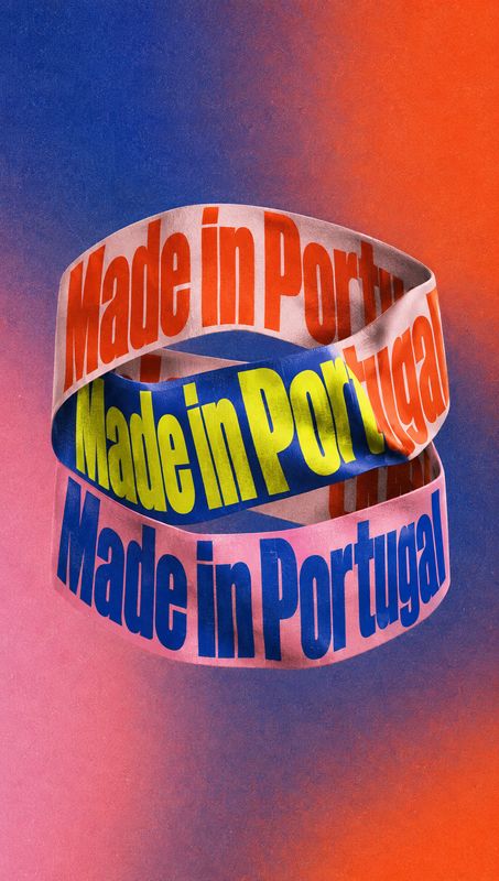 printed ribbons fashion product photo: Three curled ribbons printed with “Made in Portugal” sit against a saturated blue, pink, and orange background, creating…