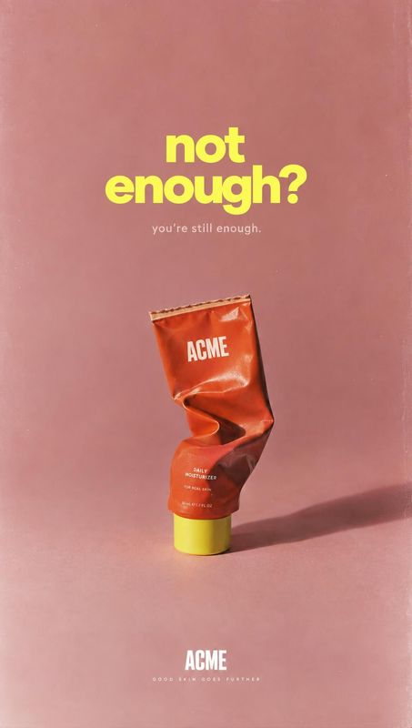 daily moisturizer packshot product photo: A crumpled orange moisturizer tube stands against a dusty rose studio backdrop beneath bold yellow lettering, with wa…