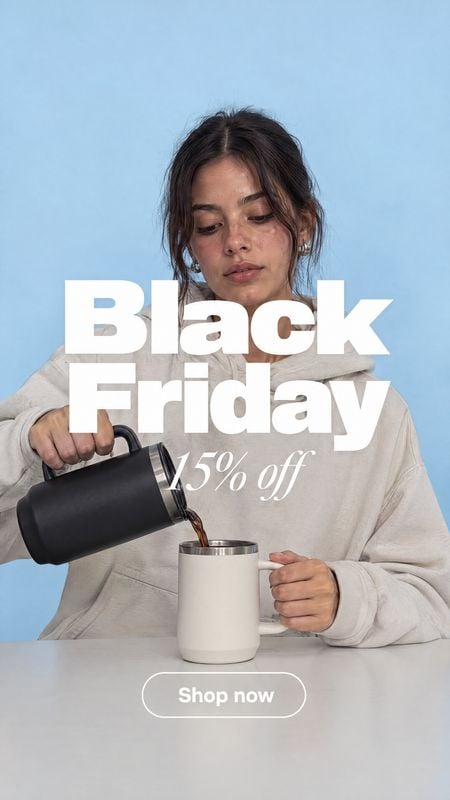 insulated travel mug and cup splash / pour product photo: A woman in a light sweatshirt pours a drink from a black insulated carafe into a white mug against a…