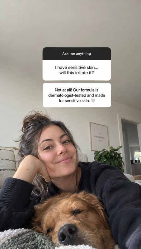 lifestyle scene product photo: A woman in a black sweater smiles beside a resting dog in a cozy home, with a Q&A about sensitive skin overlaid in a casual, rea…