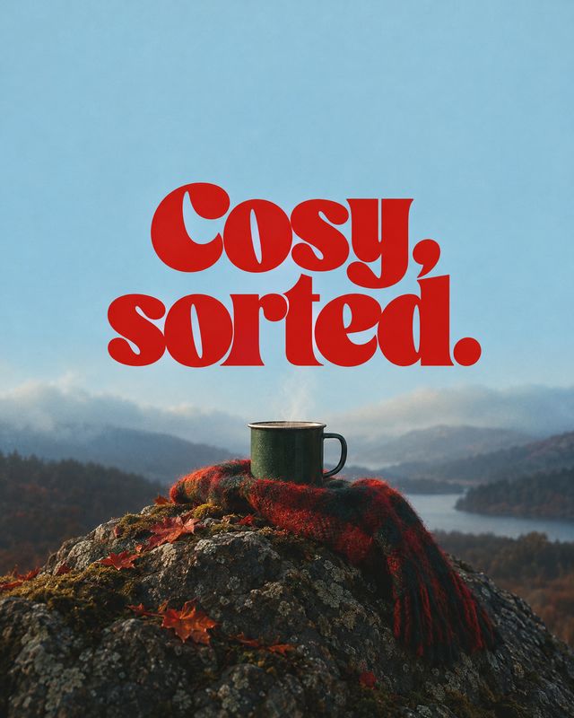 mug autumn product photo: A dark mug rests on a red plaid scarf atop a rocky overlook, with autumn leaves, a misty lake and hills below a bold red headline aga…