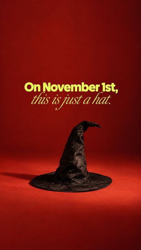 witch hat halloween product photo: A crumpled black witch hat sits on a vivid red studio floor beneath yellow headline and script typography, creating a dramat…