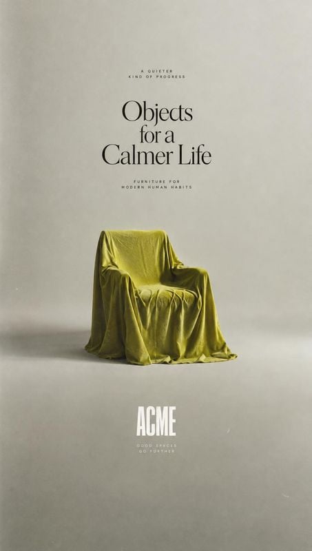 armchair home product photo: A sculptural armchair draped in olive-green fabric sits against a softly lit neutral studio backdrop, beneath refined editorial ty…