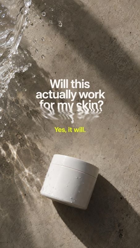 skincare cream jar splash / pour product photo: A plain white skincare jar rests on wet concrete as water splashes nearby, with bold white and lime-green text…