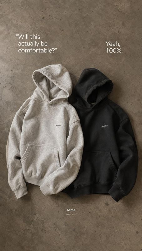 hoodies flat lay product photo: Two hoodies in light gray and black are arranged on a textured concrete surface beneath conversational white typography, creati…