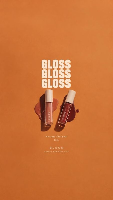lip gloss texture / swatch product photo: Two lip gloss tubes rest on glossy swatches against a warm orange studio background, with bold cream headline typogra…