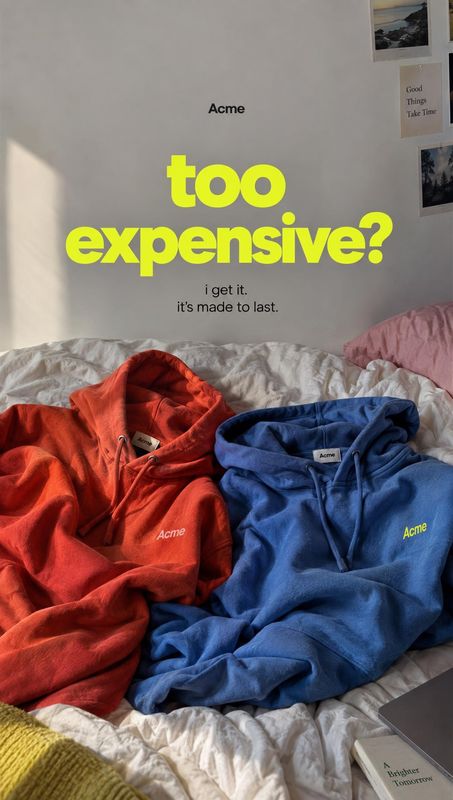 hoodies group lineup product photo: Red and blue hoodies are casually arranged on a rumpled bed beneath a large neon-yellow headline, with soft natural window…