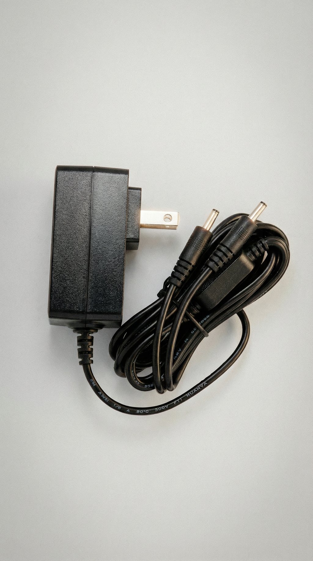 AI product shot of Bluetooth Heated Socks - Replacement Charging Adapter