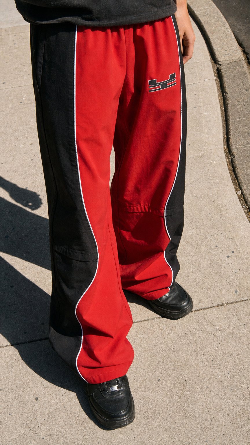 AI product shot of REMIT RED NYLON PANTS